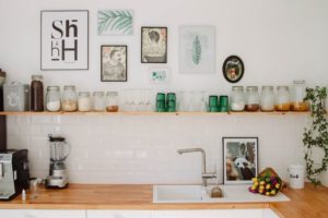 A clean rustic kitchen with blue glass water cups