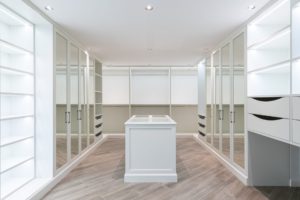 Storage closet with empty white shelves